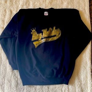 Black sweater with gold words